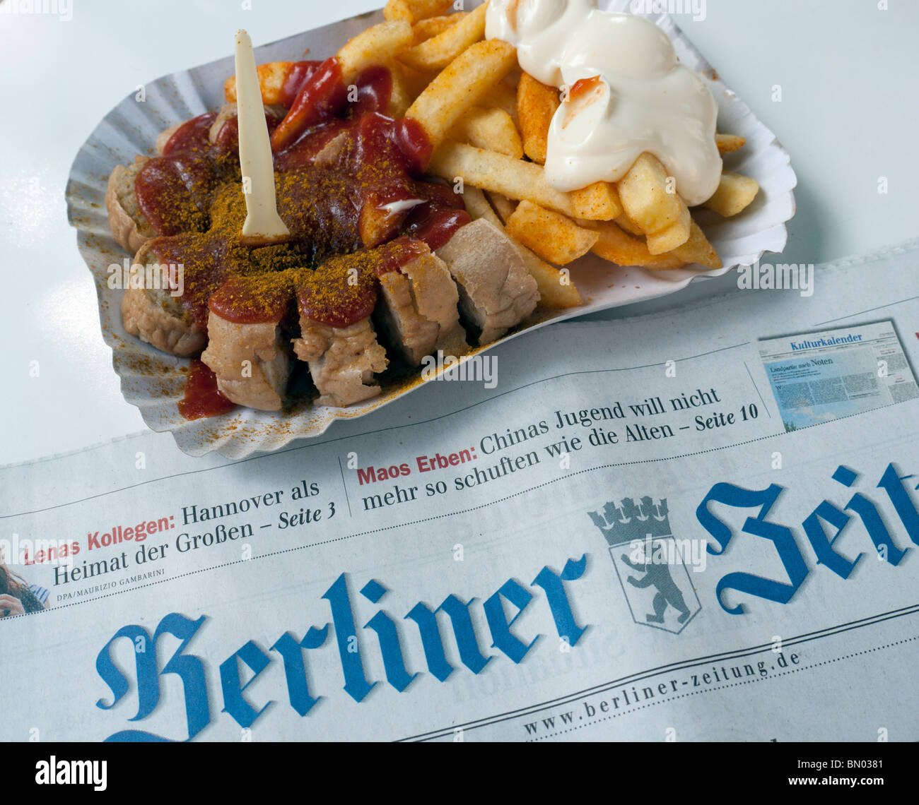 Detail of traditional Berlin currywurst snack at famous Konnopke`s currywurst stall in Prenzlauer Berg in Berlin Germany Stock Photo
